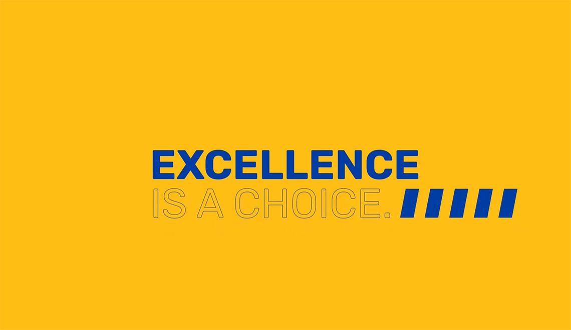 Blue words on a yellow background read Excellence is a choice