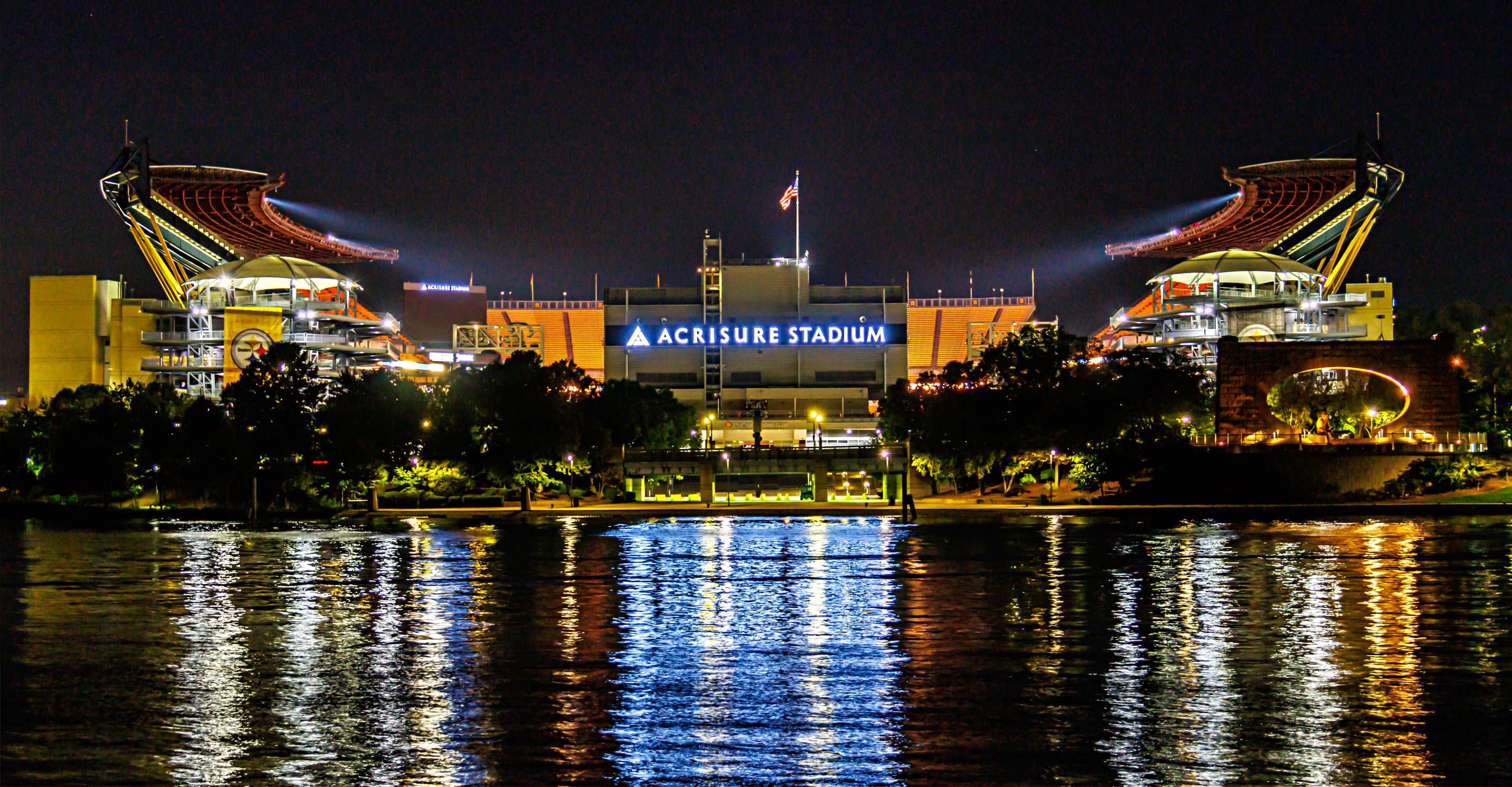 Acrisure Stadium lit up at night